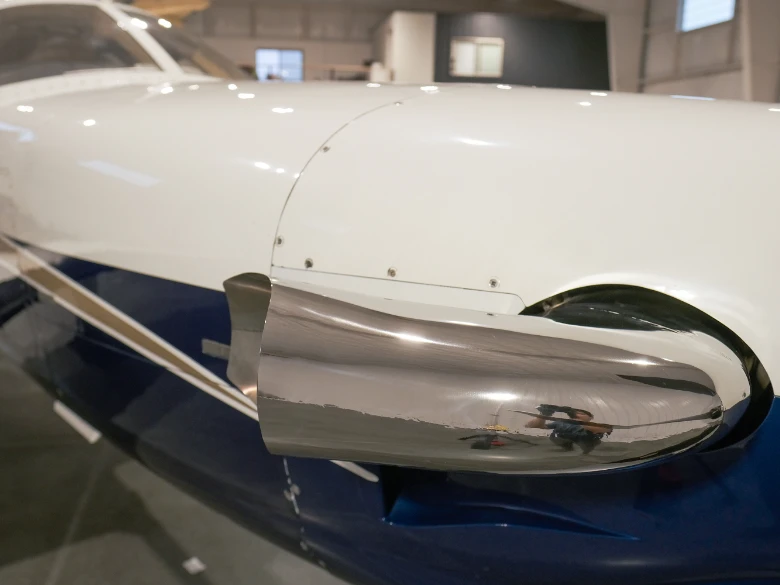 Shiny mirror-like TM700 exhaust stack after polishing by Bonner mobile detailing